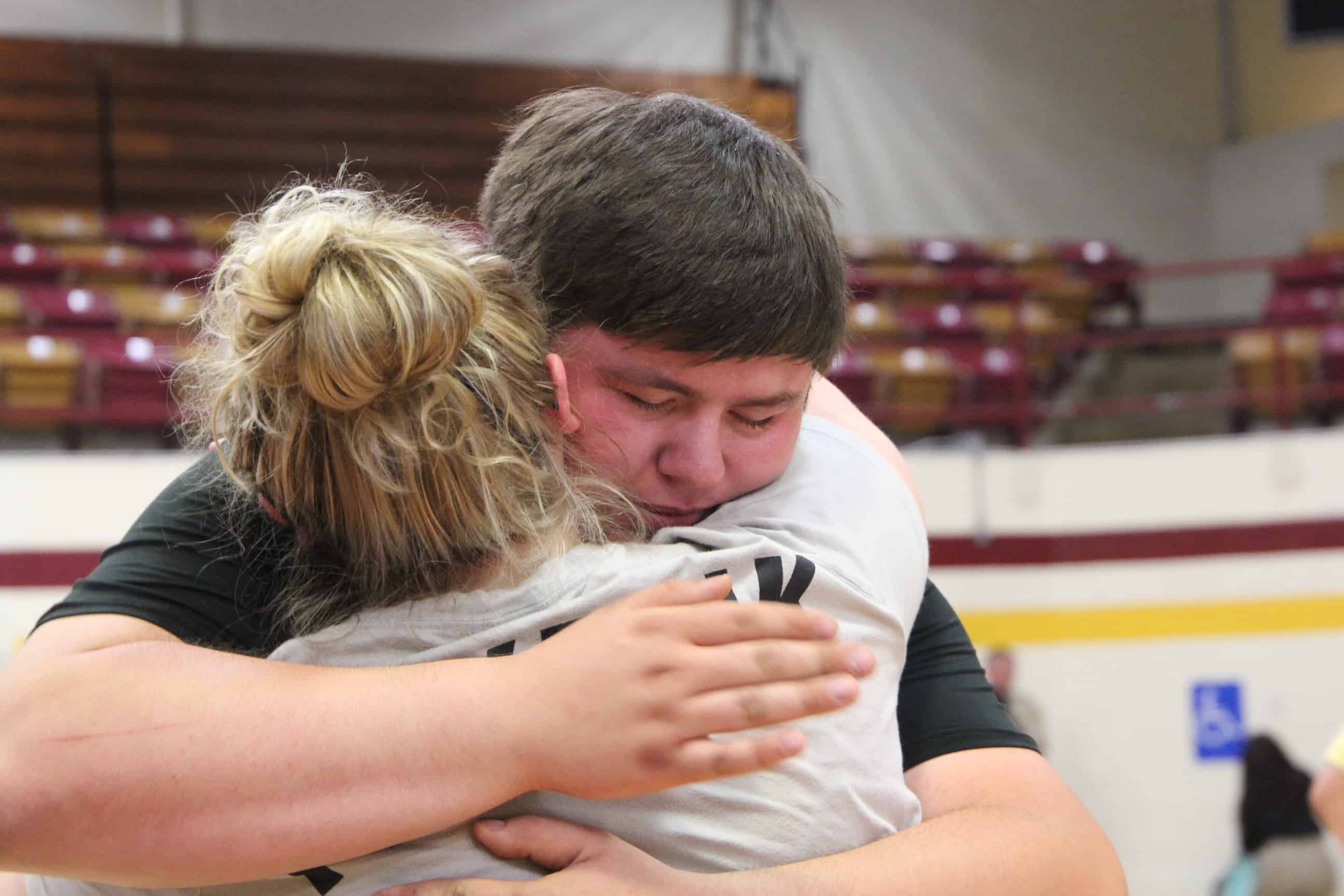 Nataly Holman with a hug of thanks to rescuer Alex Lowe.